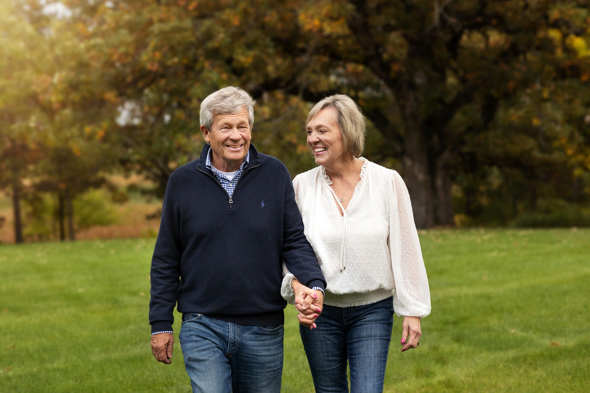 Grandparents laughing during fall family photos