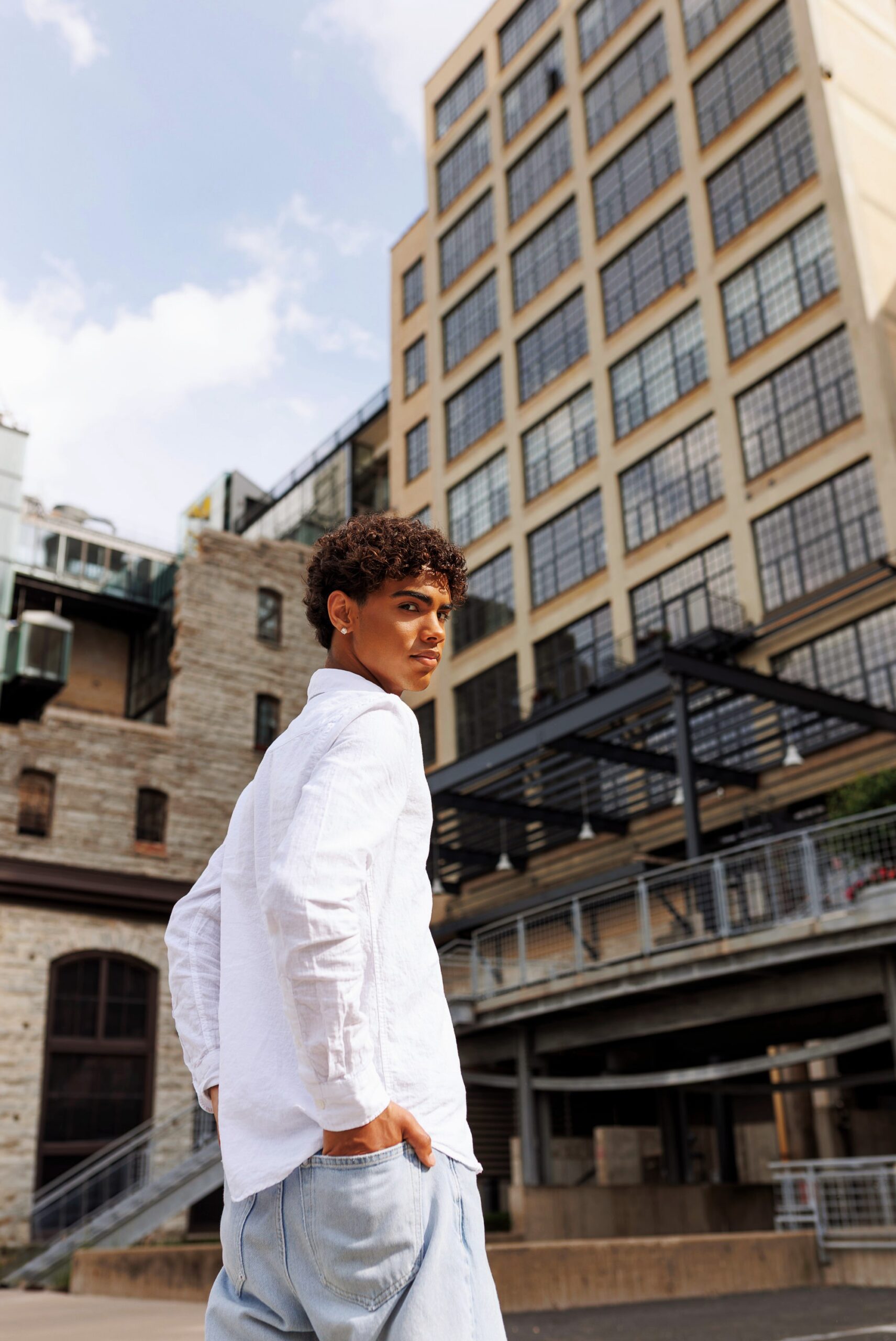 Fashion-inspired senior portrait with urban Minneapolis architecture
