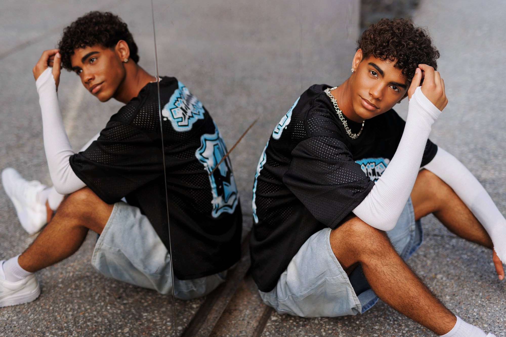 Edgy urban senior boy photos with mirrored location and stylish outfit